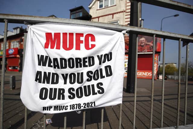 A banner left by Manchester United fans objecting to the clubs decision to join the European Super League,