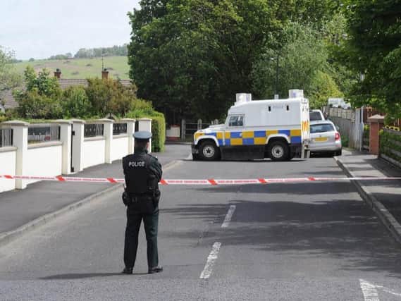 A PSNI officer pictured at the scene in Eglinton on June 18, 2015.