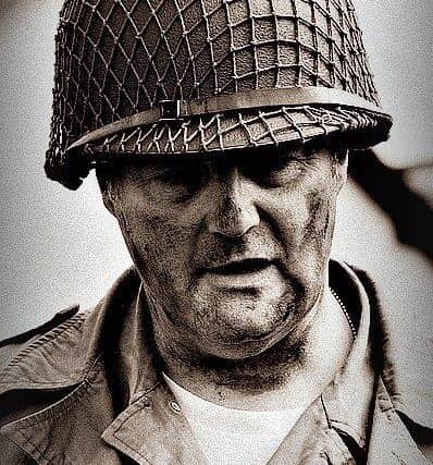 Michael Gilmore wearing a multi-function U.S. Army WWII M1 helmet