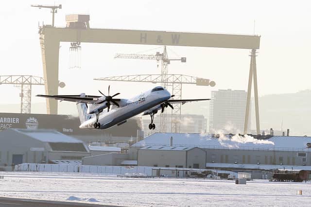 Travel throughout Northern Ireland tries to get by to normal as snow and icy conditions still effect parts of the country in December 2010. A plane takes off at George Best Belfast City Airport. Picture: Jonathan Porter/Presseye.com