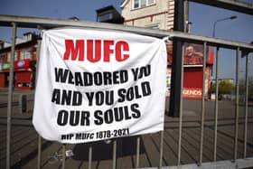 File picture of a banner left by Manchester United fans objecting to the clubs decision to join the European Super League at Sir Matt Busby Way, Manchester.