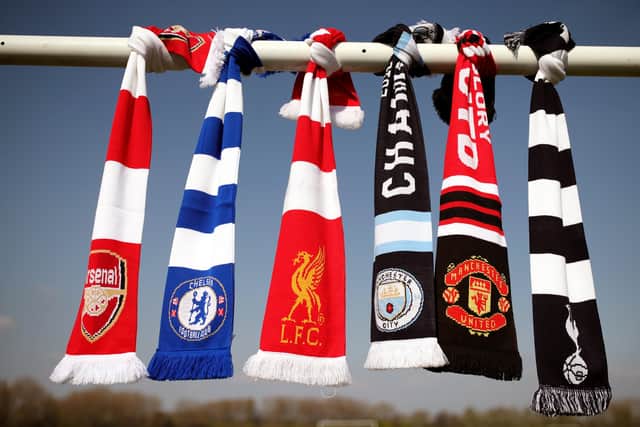 File photo dated 19-04-2021 of a selection of of Arsenal, Chelsea, Liverpool, Manchester City, Manchester United and Tottenham Hotspur scarves. Picture date: Monday April 19, 2021. Issue date: Wednesday April 21, 2021.