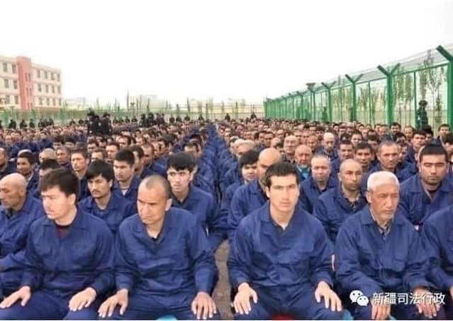 Uyghur detainees in a Chinese concentration camp. Image from Human Rights Watch which captioned it: "Government social media post in April 2017 shows detainees in a political education camp in Lop County, Hotan Prefecture, Xinjiang."