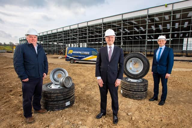 Rory Byrne, Director of Modern Tyres with Kevin Holland, CEO, Invest NI and James McKee, Financial Director, Modern Tyres