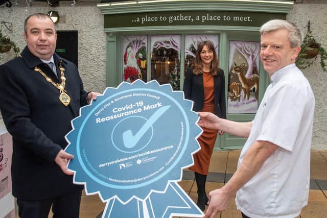 Mayor of Derry City and Strabane District Council, Councillor Brian Tierney, pictured with Tara Nicholas, Council Business Support Officer, and local restaurateur Raymond Moran, at the launch of the Covid-19 Reassurance Mark