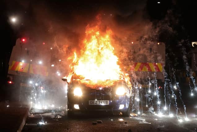 A vehicle burns during disturbances in the Tiger’s Bay area of north Belfast earlier this month