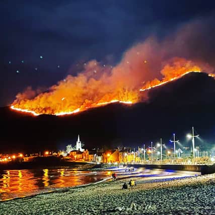 The huge gorse fire spreading across the Mourne Mountains in Co Down, as seen from Newcastle.