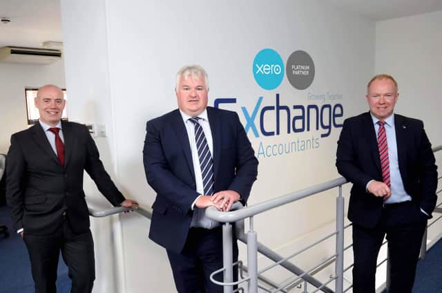Exchange Accountants directors Conor Walls, William Gould and Gary Laverty proudly display the Xero Platinum badge on the office wall after the digital accountancy specialist achieved Platinum Partner status with market-leading cloud accountancy software provider Xero