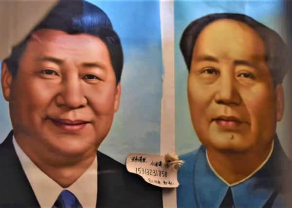 A still from a BBC report on Chinese treatment of the Uyghurs, depicting current Chinese leader Xi Jinping (left) and former dictator Chairman Mao