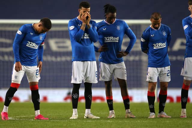 Rangers players react after losing the penalty shoot-out during the Scottish Cup Quarter Final match at Ibrox Stadium, Glasgow.