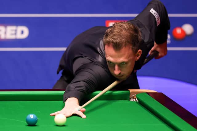 Judd Trump plays a shot during the Betfred World Snooker Championships 2021 at The Crucible, Sheffield.