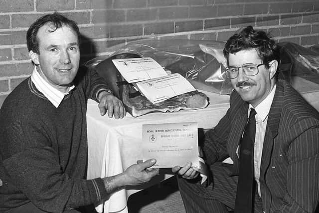 Robin Todd from Banbridge receives the champion bacon carcase from Lyle Rea, agricultural manager, RUAS, after the show and sale of pedigree pigs which was held at Balmoral in March 1991. Picture: Farming Life archives
