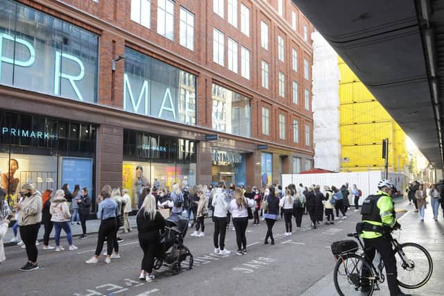 Shoppers queue outside Primark in Belfast as shops reopen and hospitality is able to open outdoors in Northern Ireland where lockdown restrictions have begun to gradually ease.