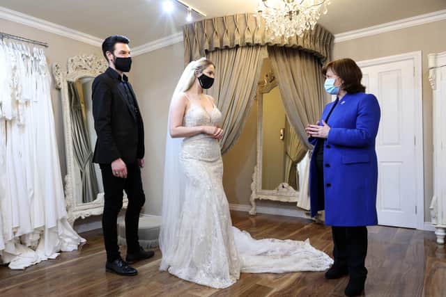 Economy Minister, Diane Dodds, met Neil Anderson, the owner of Orchard Bridal shop, and bride to be Christine van Schalkwyk during a visit to Portadown