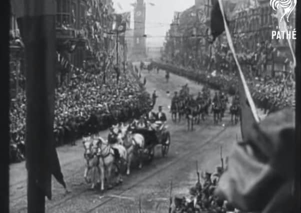 King George V’s carriage makes its way through Belfast in June 1921