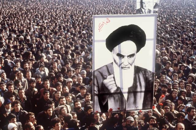 Demonstrators hold a poster of Ayatollah Ruhollah Khomeini, in January 1979, in Tehran, during a demonstration against the shah. Picture: AFP via Getty Images