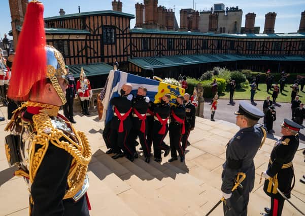 The Duke of Edinburgh's coffin is carried into St George's Chapel, Windsor Castle  as The Band and Bugles of The Rifles played led by Captain Justin Teggarty. Picture by PA