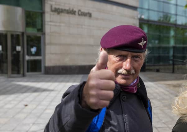 A man wearing the beret of the British Parachute Regiment gives a thumbs up outside Laganside Court in Belfast after the case against two veterans who were accused of the murder of Joe McCann 1972 collapsed. Photo: Liam McBurney/PA Wire