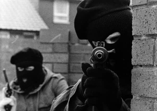 IRA terrorists pictured on the Whiterock Road in Belfast during the Troubles