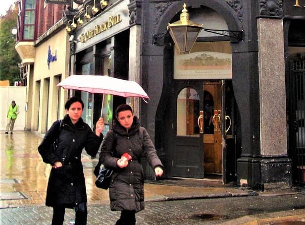 Generic image of women outside a pub on a rainy day, by artist It's No Game, from: https://search.creativecommons.org/photos/9c76aca9-2bc9-4eb3-b351-e12dc0418c6c
