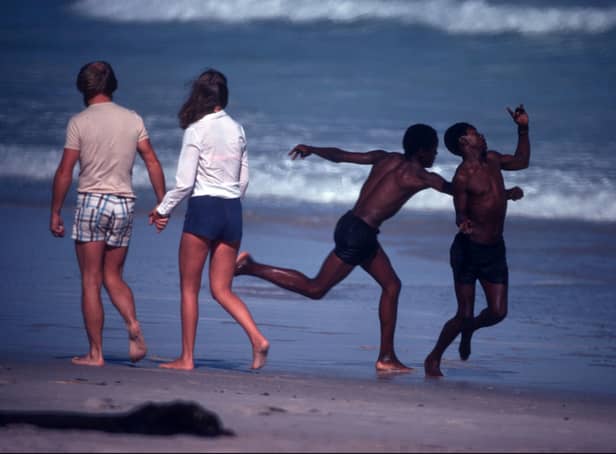 White people and black people on a legally designated 'whites only' beach in Cape Province, South Africa during the apartheid era. 1984. There was no such formal segregation of the two main communities in Northern Ireland,writes George McNally