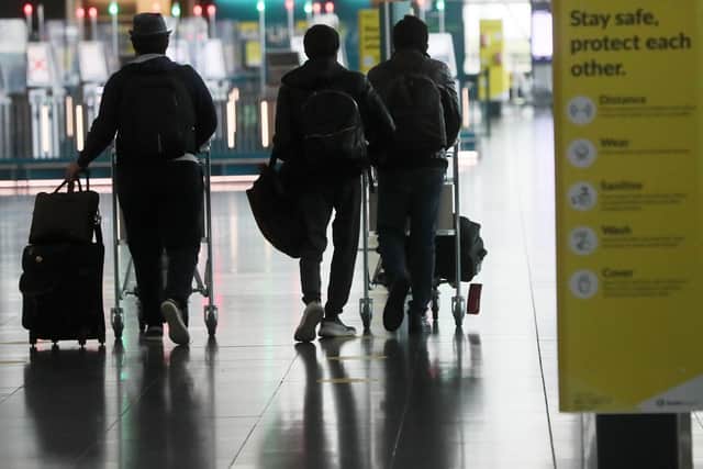Passengers make their way through Dublin Airport. (Photo: PA)