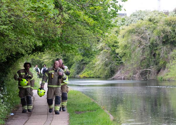 Emergency services on the Grand Union Canal near Old Oak Lane in north west London where the baby was found. Photo: David Parry/PA Wire