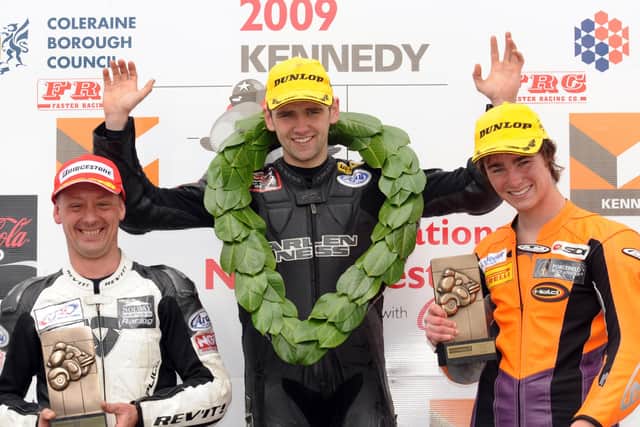 William Dunlop celebrates winning the 125cc race at the North West 200 with runnerup Chris Palmer (left) and third place man Olie Linsdell.