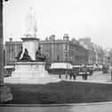 Photograph looking out from City Hall, Donegall Square, Belfast, in the direction of the Linen Hall Library. NLI Ref.: L_CAB_04202. Picture: National Library of Ireland