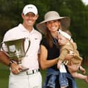 Rory McIlroy celebrates with the trophy alongside his wife Erica and daughter Poppy after winning the 2021 Wells Fargo Championship at Quail Hollow. (Photo by Jared C. Tilton/Getty Images)