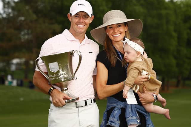 Rory McIlroy celebrates with the trophy alongside his wife Erica and daughter Poppy after winning the 2021 Wells Fargo Championship at Quail Hollow. (Photo by Jared C. Tilton/Getty Images)