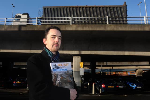 Wesley Johnston at the M3 Flyover in Belfast in 2014 holding his book about motorway plans around the city. Wesley a roads expert who runs the Northern Ireland Roads Site https://www.wesleyjohnston.com/
Pic Colm Lenaghan/Pacemaker