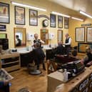 The Johnston Brothers photographed pre-lockdown in their Barbershop-Museum. L-R. Selwyn, Nigel and Gordon