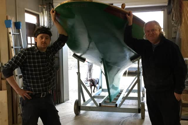 Paul Louden-Brown with son Conor as Petrel finally leaves the workshop