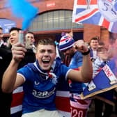 Rangers fans celebrate outside of the Ibrox Stadium after Rangers secured the Scottish Premiership title at the start of March