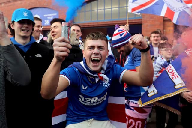 Rangers fans celebrate outside of the Ibrox Stadium after Rangers secured the Scottish Premiership title at the start of March