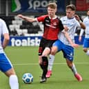 Crusaders' Jack Patterson tussles with Ben Doherty of Coleraine