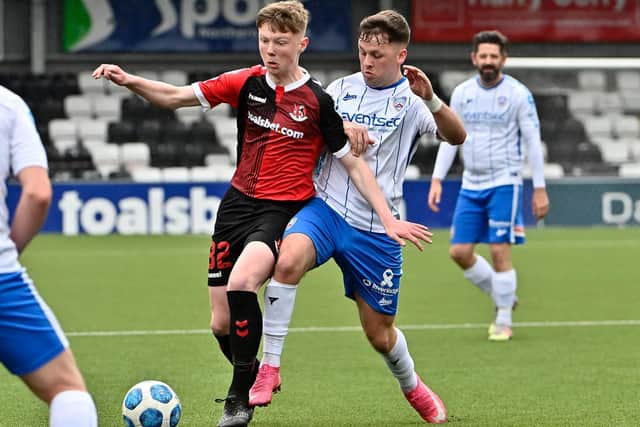 Crusaders' Jack Patterson tussles with Ben Doherty of Coleraine