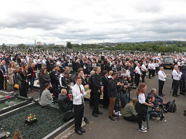 A crowd listens to Gerry Adams of Sinn Fein speak at the funeral of the IRA man Bobby Storey at Milltown Cemetery in west Belfast last June. "The fact remains that breaches of the regulations took place at the funeral," writes Mervyn Storey. Photo: Liam McBurney/PA