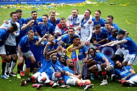 Rangers players celebrate following Saturday's Scottish Premiership trophy presentation. Pic by PA.