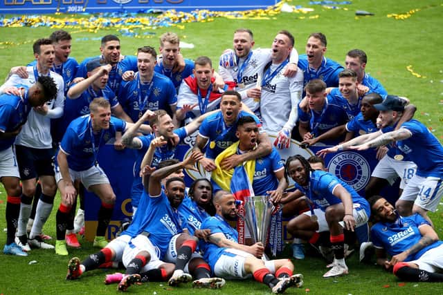 Rangers players celebrate following Saturday's Scottish Premiership trophy presentation. Pic by PA.