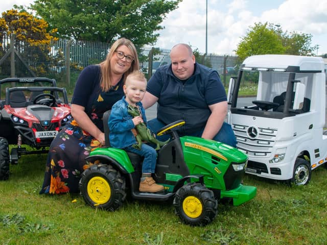 Andrew and Danielle Mitchell, owners of Wee Wheels Ride On Cars with young Jaxon
