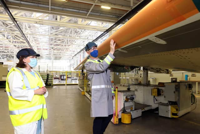 Economy Minister Diane Dodds with Spirit AeroSystems vice president and general manager Michael Ryan pictured with the new Spirit AeroSystems branding outside the wing factory following a meeting and tour of the plant
