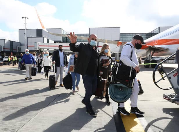 Holidaymakers boarding and EasyJet aircraft bound for Portugal.