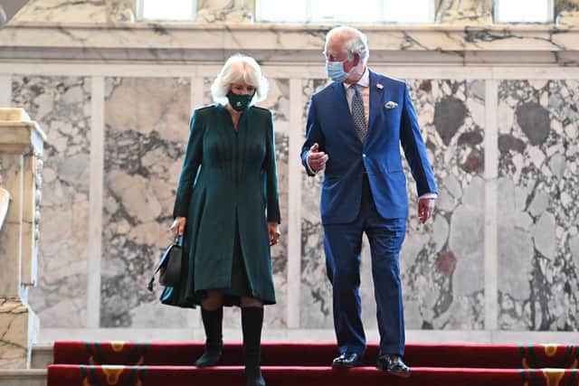 The Prince of Wales and the Duchess of Cornwall during a visit to Belfast City Hall in Donegall Square, Belfast. Picture date: Tuesday May 18, 2021.