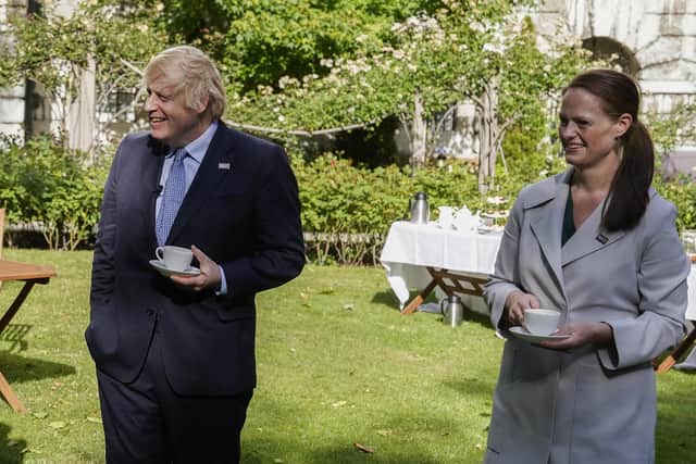 Jenny McGee (right) at a Downing Street garden party with Prime Minister Boris Johnson (left) who she looked after while he was in hospital suffering from Covid-19 and who has now resigned, citing the Government's 1% pay offer and its lack of respect for the profession.