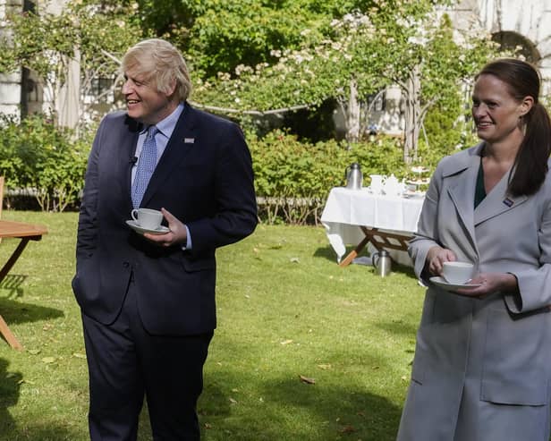 Jenny McGee (right) at a Downing Street garden party with Prime Minister Boris Johnson (left) who she looked after while he was in hospital suffering from Covid-19 and who has now resigned, citing the Government's 1% pay offer and its lack of respect for the profession.
