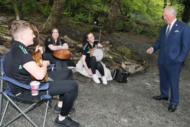 In the Fairy Glen, Prince Charles watched a musical performance by a group of children from The Ring of Gullion Traditional Arts Partnership, a community arts association, learning about the local legends and myths.
Picture by Jonathan Porter/PressEye