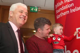 Chief Executive of BHF NI Fergal McKinney with Mairtin MacGabhawn and his four-year-old son Daithi, who urgently needs a heart transplant. Photo: Press Eye.