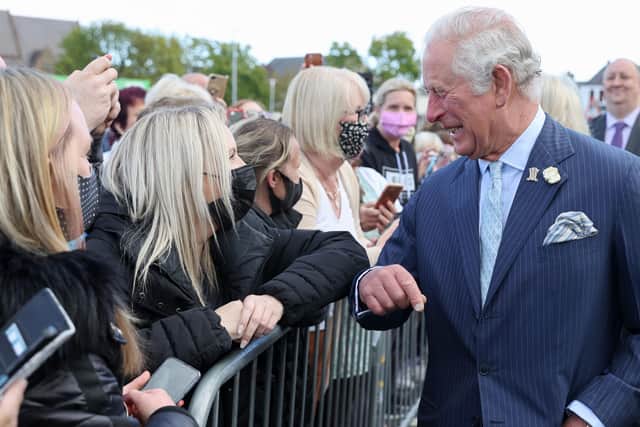 The Prince of Wales during a visit to Bangor Market where he walked around and meeting stall holders at the open-air market. Picture date: Wednesday May 19, 2021